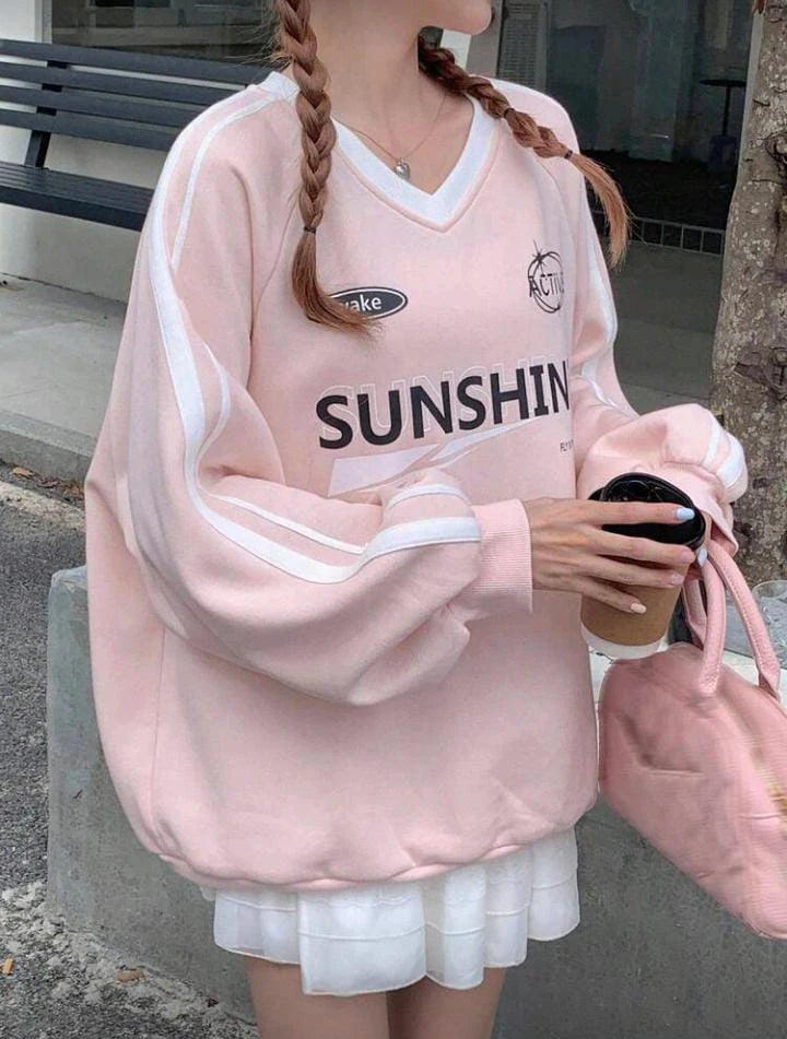 سويت شيرت نسائي وردي مطبوع - تصميم كاجوال